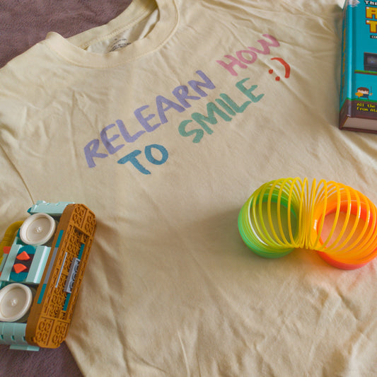 Relearn How To Smile Tee